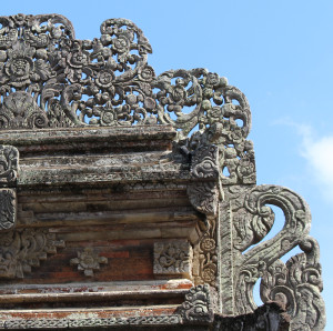 Lempad's filigree stonework on one of the outside gates, Ubud royal palace, Bali.