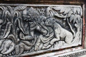 Part of a bas relief with scenes from the Tantri cycle at the base of a building in Lempad's Bedulu house.